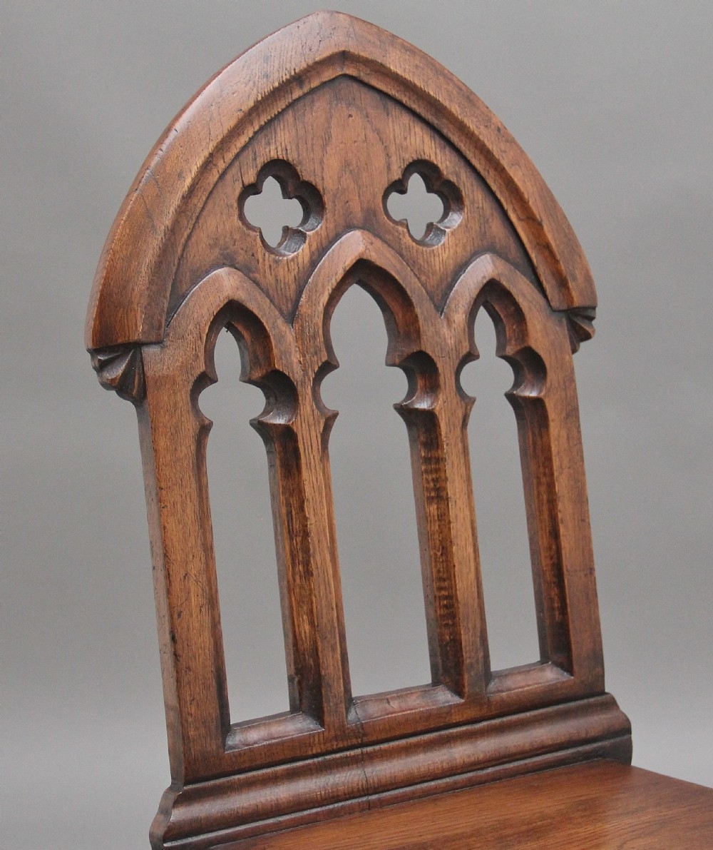 Set of four early 20th Century Gothic style hall chairs View VII