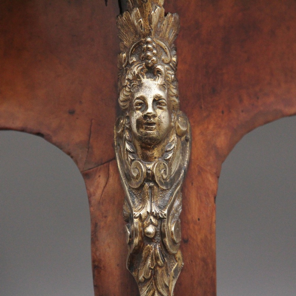 A 19th-century burr walnut bureau plat writing table with decorative gilt-bronze mounts, cabriole legs, and a dark leather inset top. View XIII