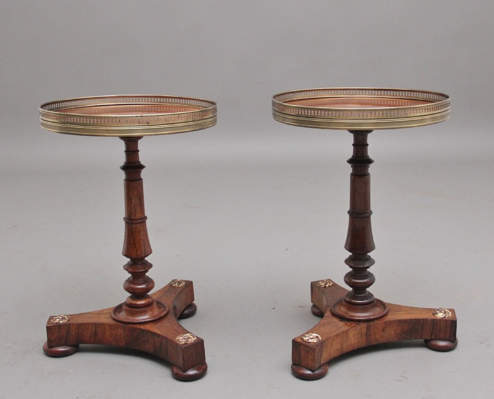 A decorative pair of early 19th Century rosewood wine tables