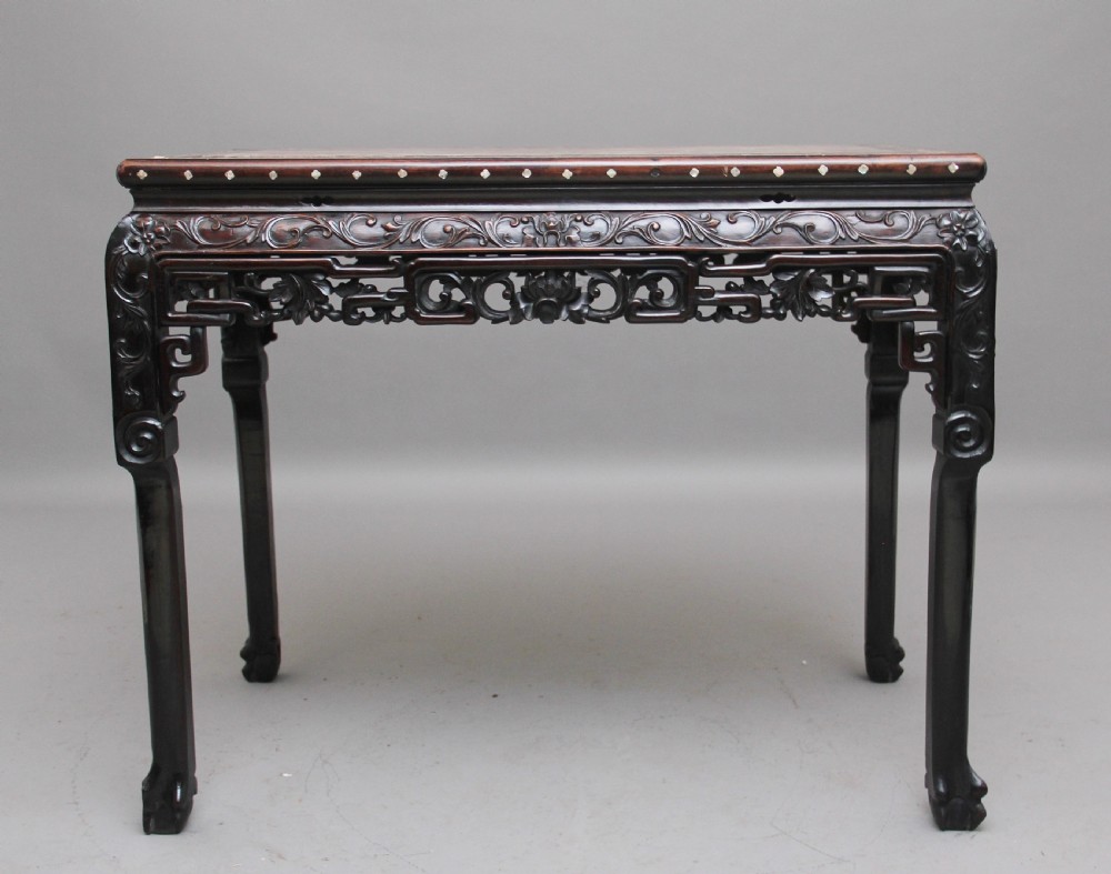 A dark carved hardwood Chinese centre table with an inset marble top and mother-of-pearl inlay along the frame. View II