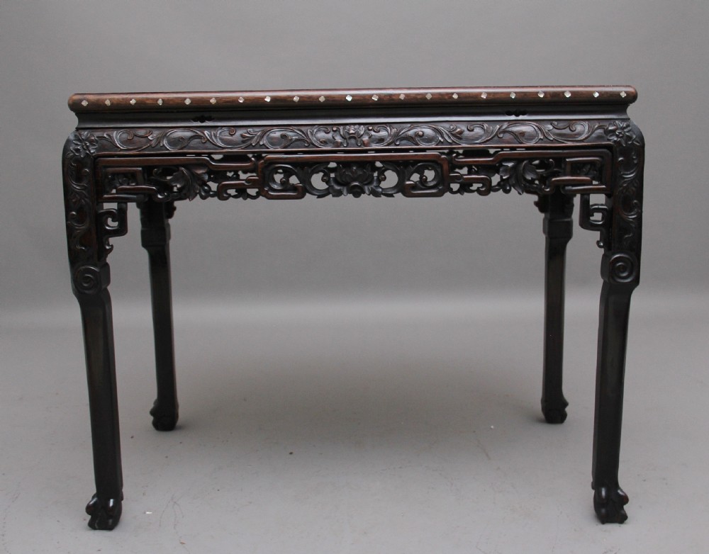 A dark carved hardwood Chinese centre table with an inset marble top and mother-of-pearl inlay along the frame. View IV