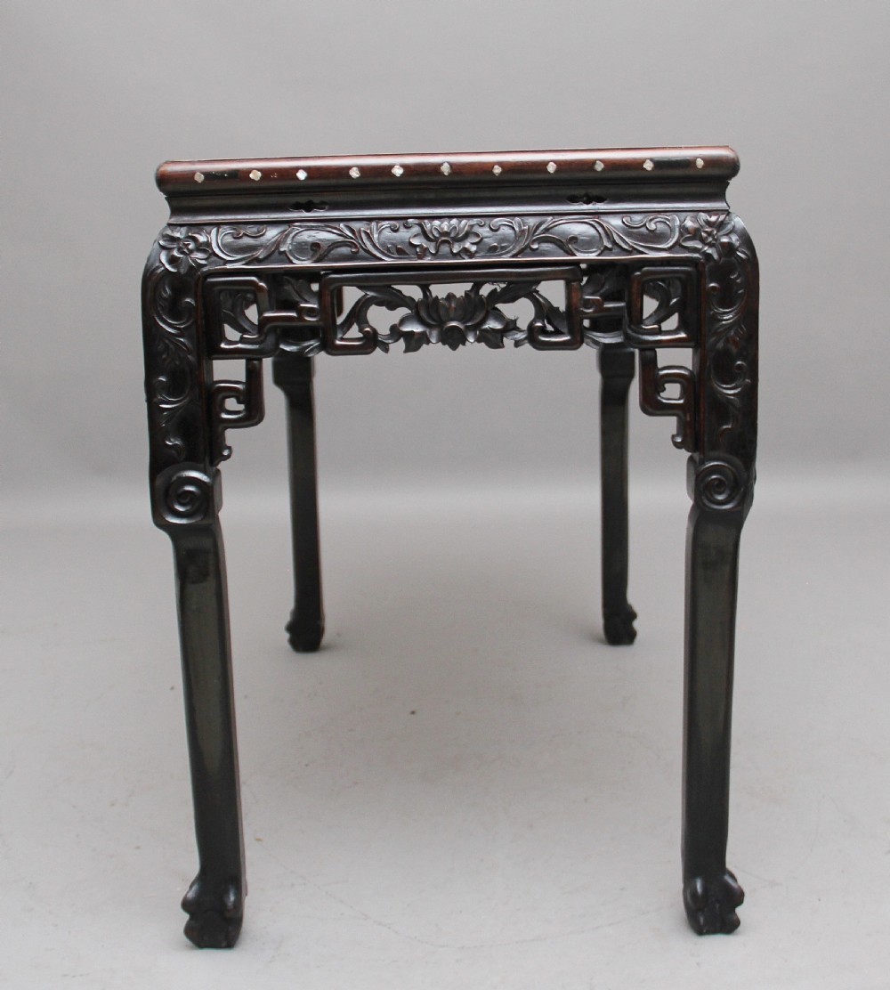 A dark carved hardwood Chinese centre table with an inset marble top and mother-of-pearl inlay along the frame. View V
