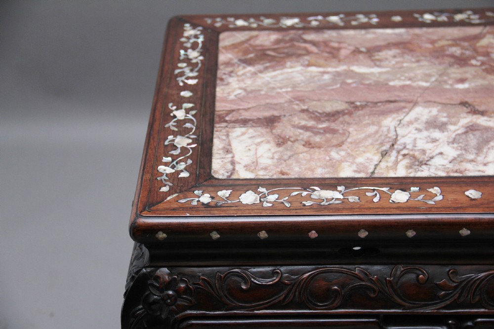 A dark carved hardwood Chinese centre table with an inset marble top and mother-of-pearl inlay along the frame. View VII