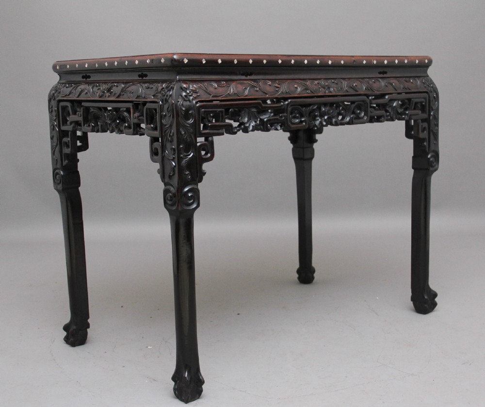 A dark carved hardwood Chinese centre table with an inset marble top and mother-of-pearl inlay along the frame. View VIII