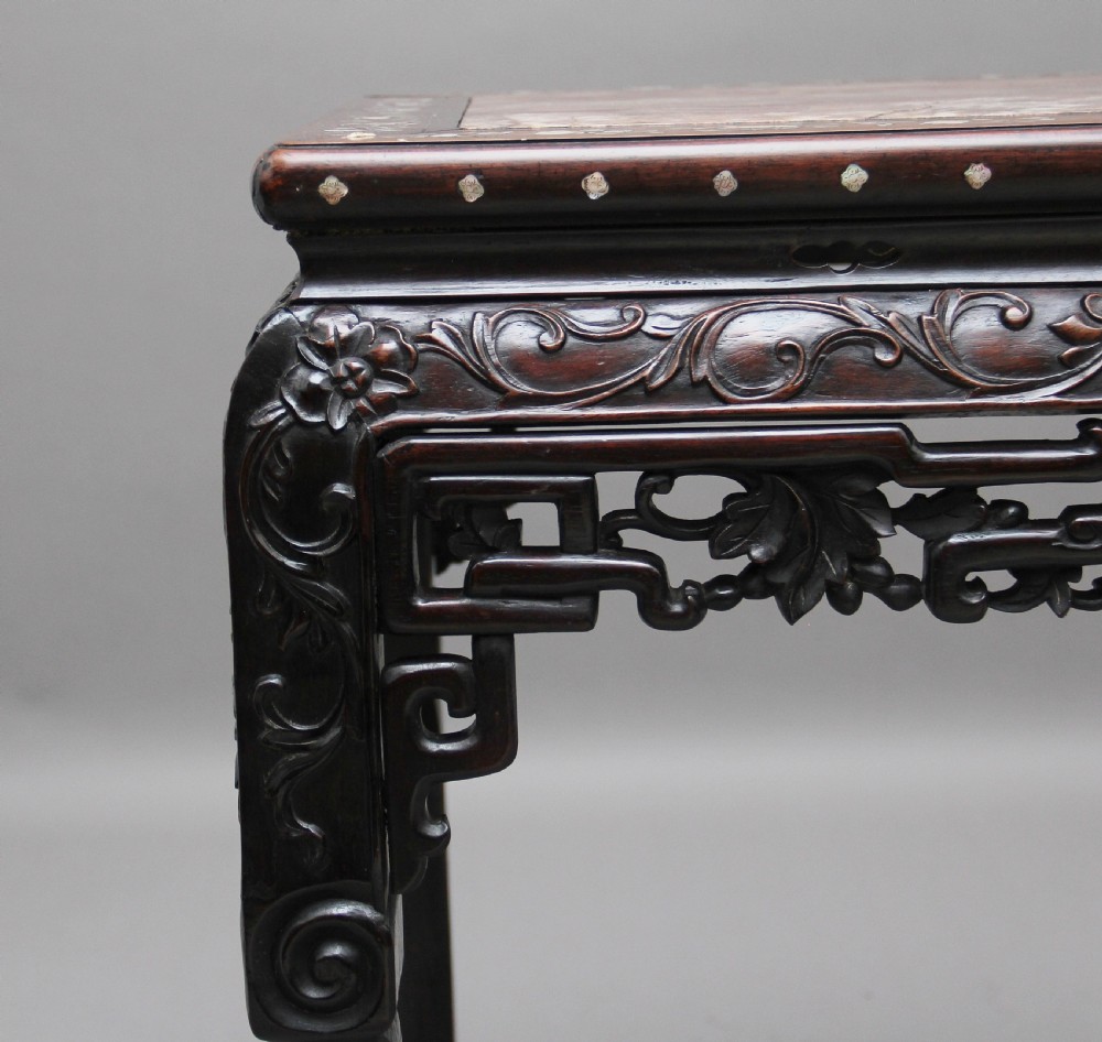 A dark carved hardwood Chinese centre table with an inset marble top and mother-of-pearl inlay along the frame. View IX