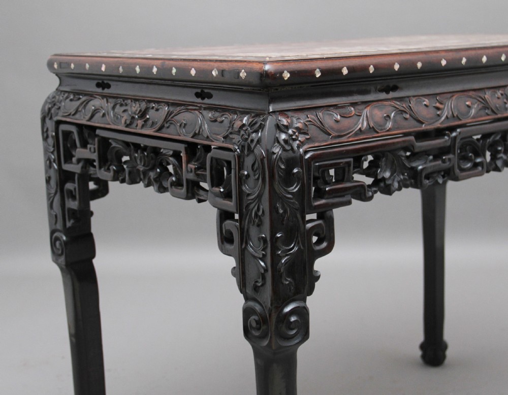 A dark carved hardwood Chinese centre table with an inset marble top and mother-of-pearl inlay along the frame. View X