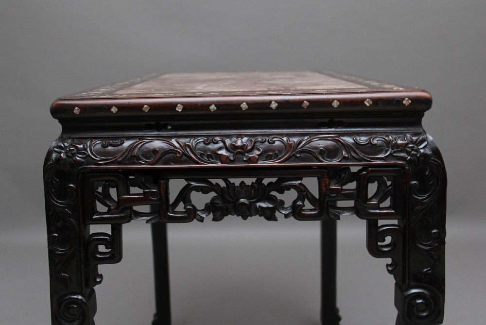 A dark carved hardwood Chinese centre table with an inset marble top and mother-of-pearl inlay along the frame. View XI