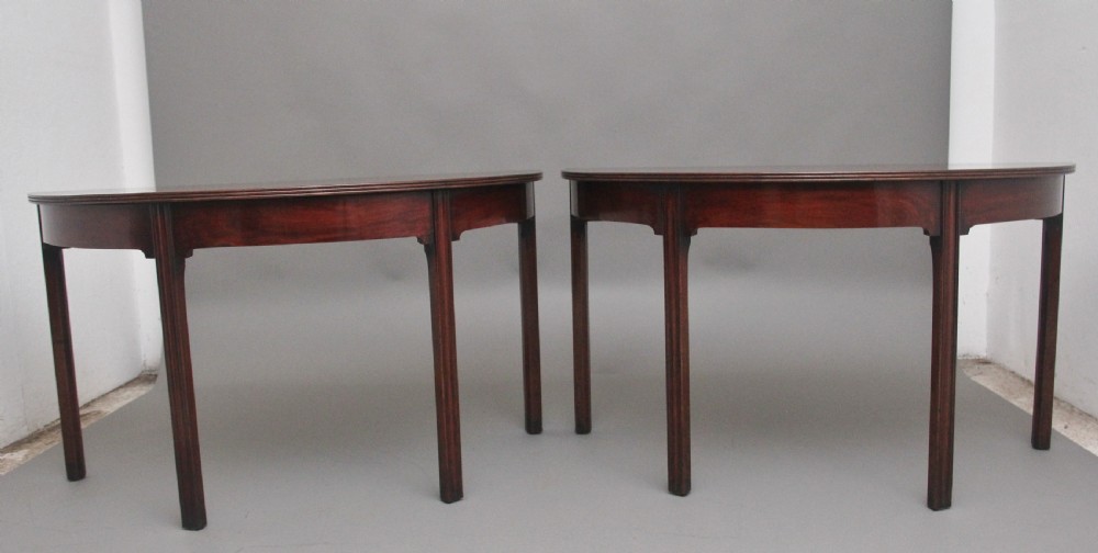 A fine pair of early 19th Century mahogany demi-lune console tables View II