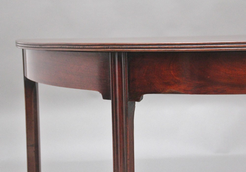 A fine pair of early 19th Century mahogany demi-lune console tables View VII