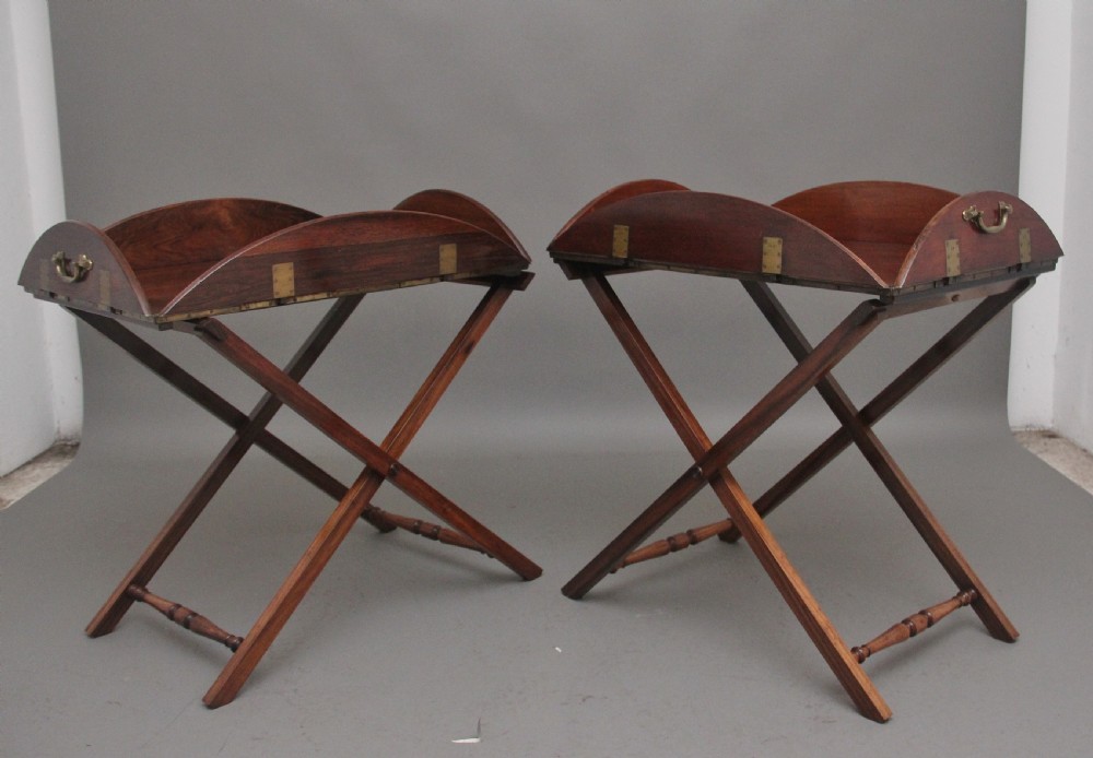 A pair of 19th Century rosewood folding butlers tray on stands