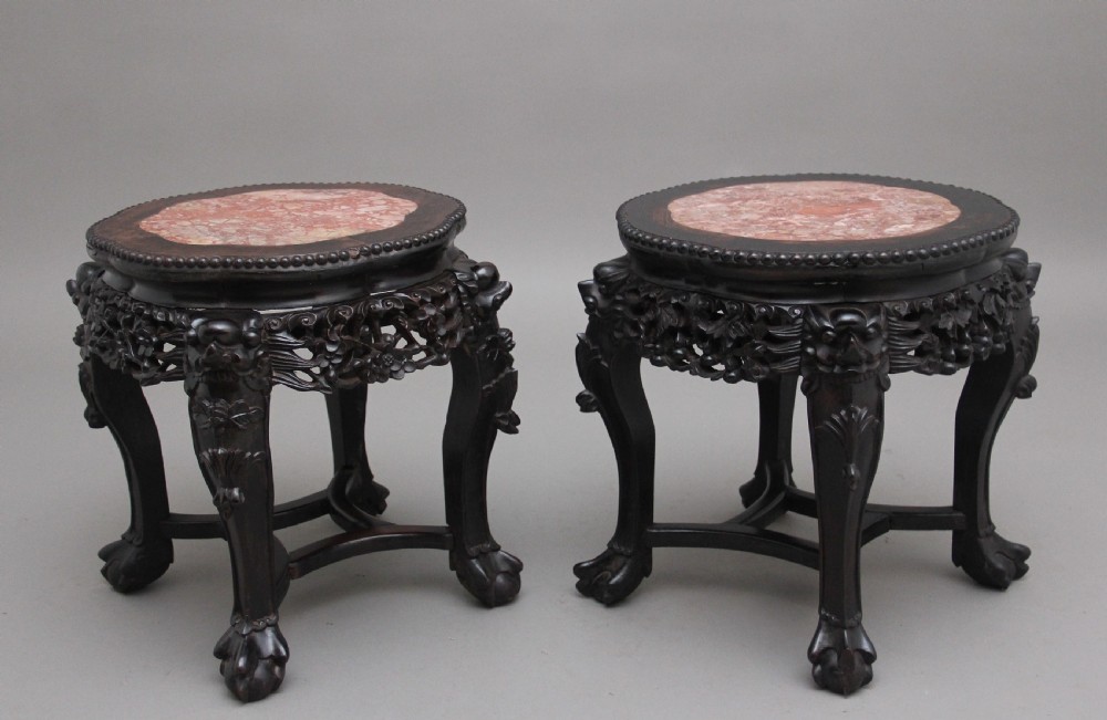 A pair of 19th Century antique Chinese carved hardwood tables