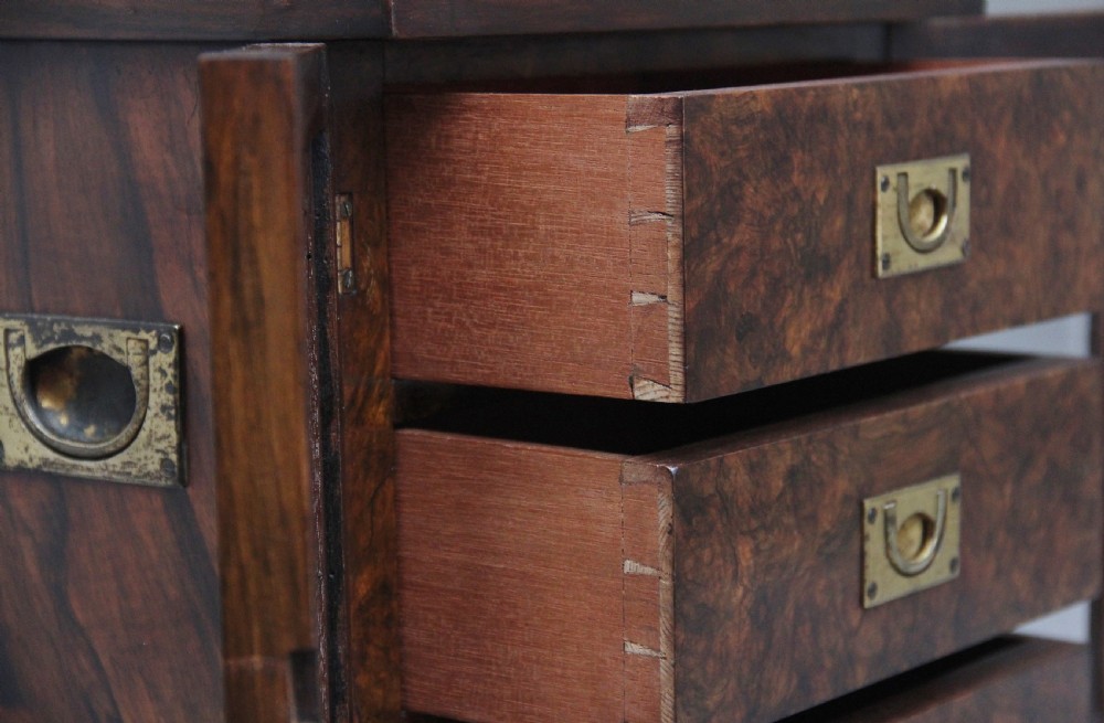 A 19th-century burr walnut tabletop cabinet with an open glazed door showing interior drawers with brass flush handles. View V