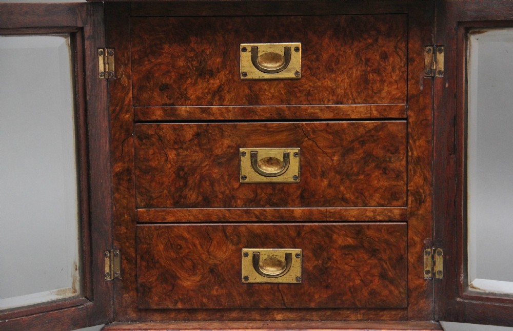 A 19th-century burr walnut tabletop cabinet with an open glazed door showing interior drawers with brass flush handles. View VIII