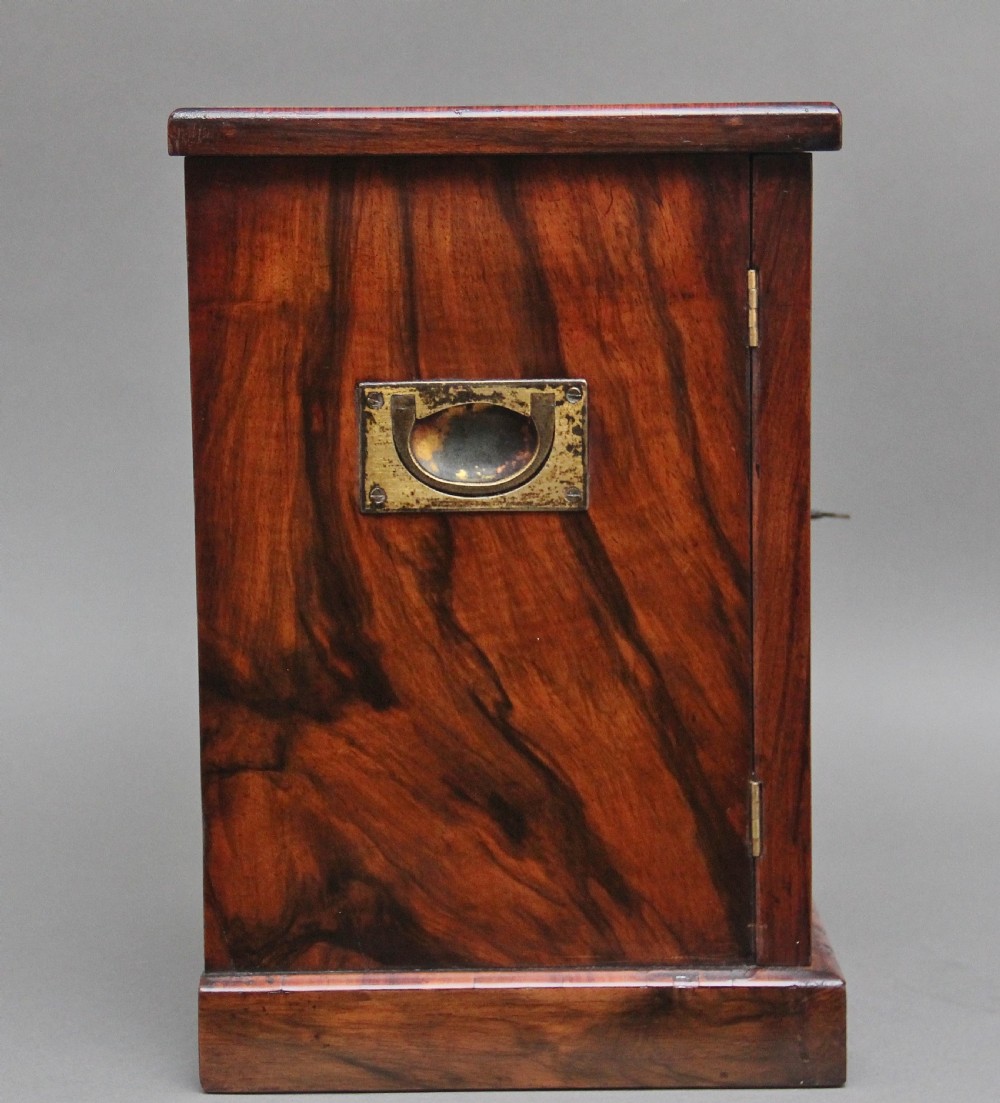 A 19th-century burr walnut tabletop cabinet with an open glazed door showing interior drawers with brass flush handles. View IX