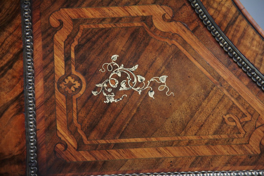 A nineteenth-century French walnut and kingwood bureau de dame with floral marquetry inlay, brass mounts, cabriole legs, and an upper cabinet with mirrored doors. View XXV