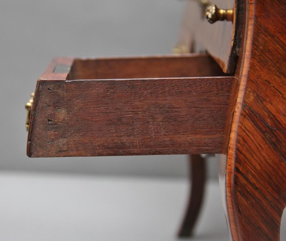 A 19th-century miniature walnut desk with geometric parquetry pattern, a cylinder roll top, cabriole legs, and brass handles. View XI