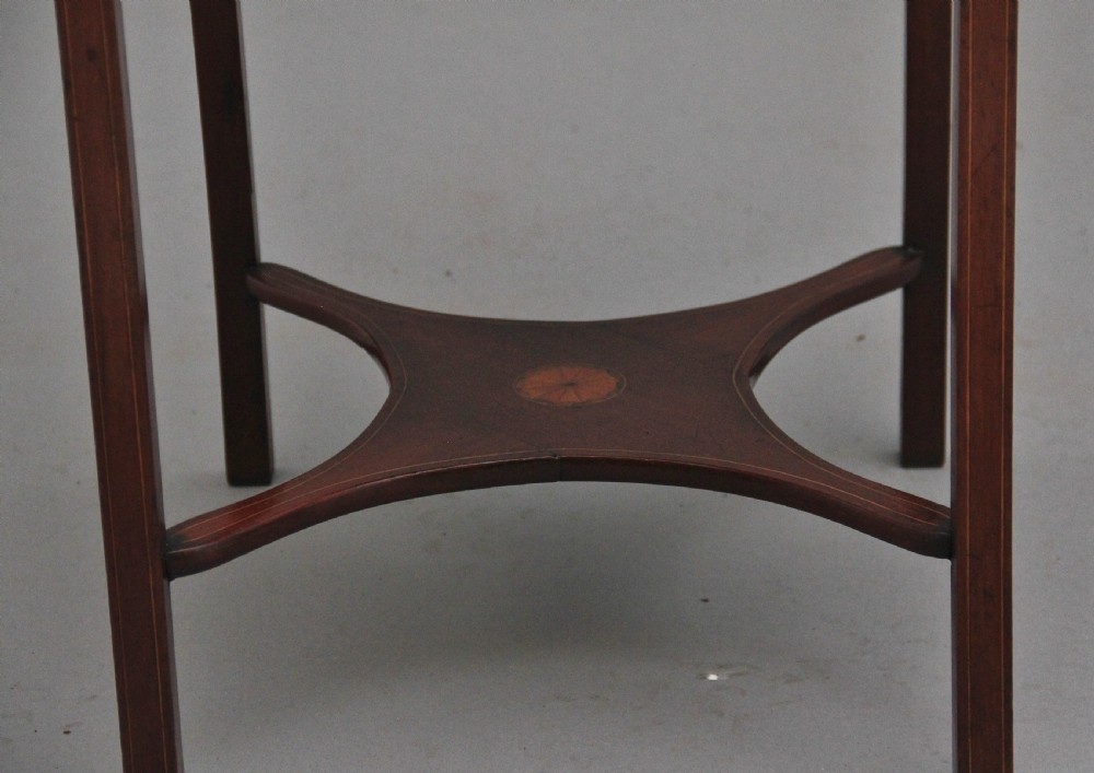 A tall, slender 19th-century mahogany bedside table featuring line inlay, a single drawer with a round brass knob, an open upper shelf tier, and an X-frame lower stretcher. View XI