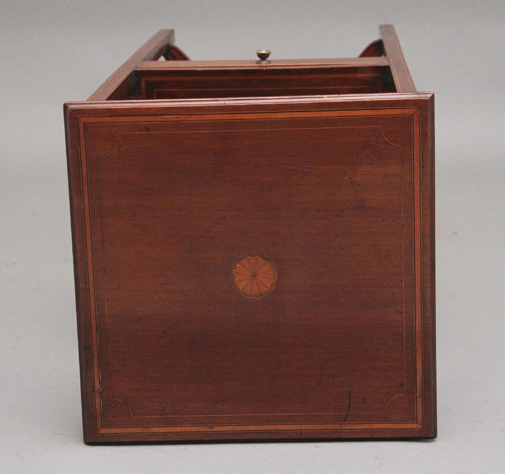 A tall, slender 19th-century mahogany bedside table featuring line inlay, a single drawer with a round brass knob, an open upper shelf tier, and an X-frame lower stretcher. View XII