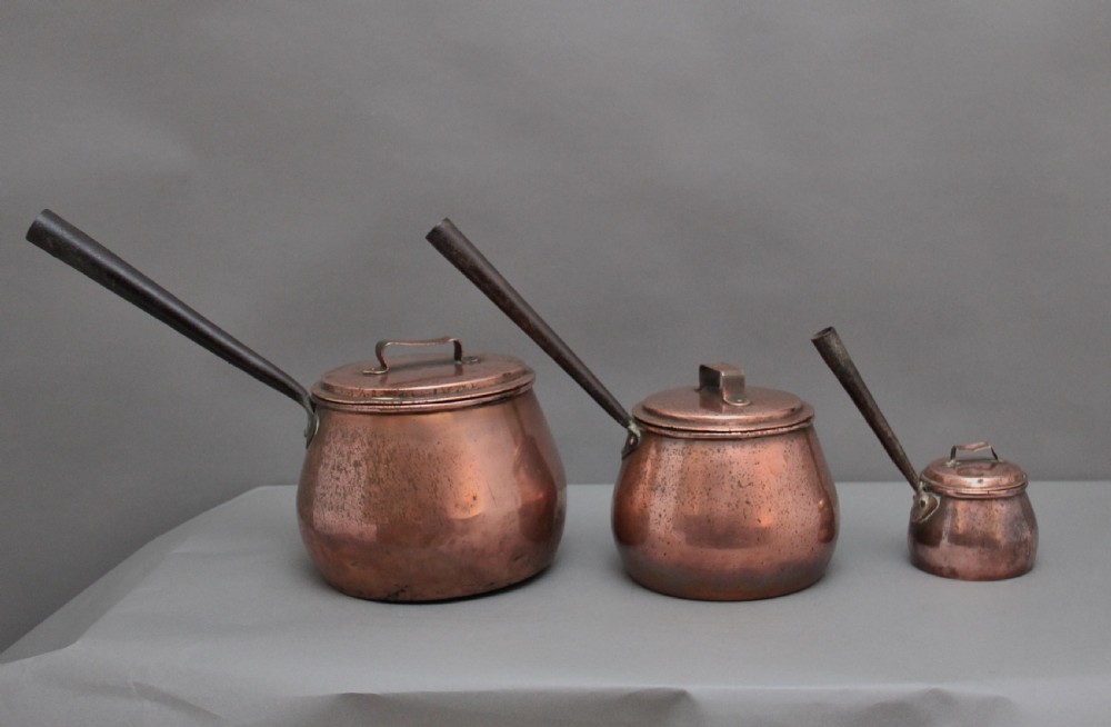 A set of three Victorian copper saucepans View IV
