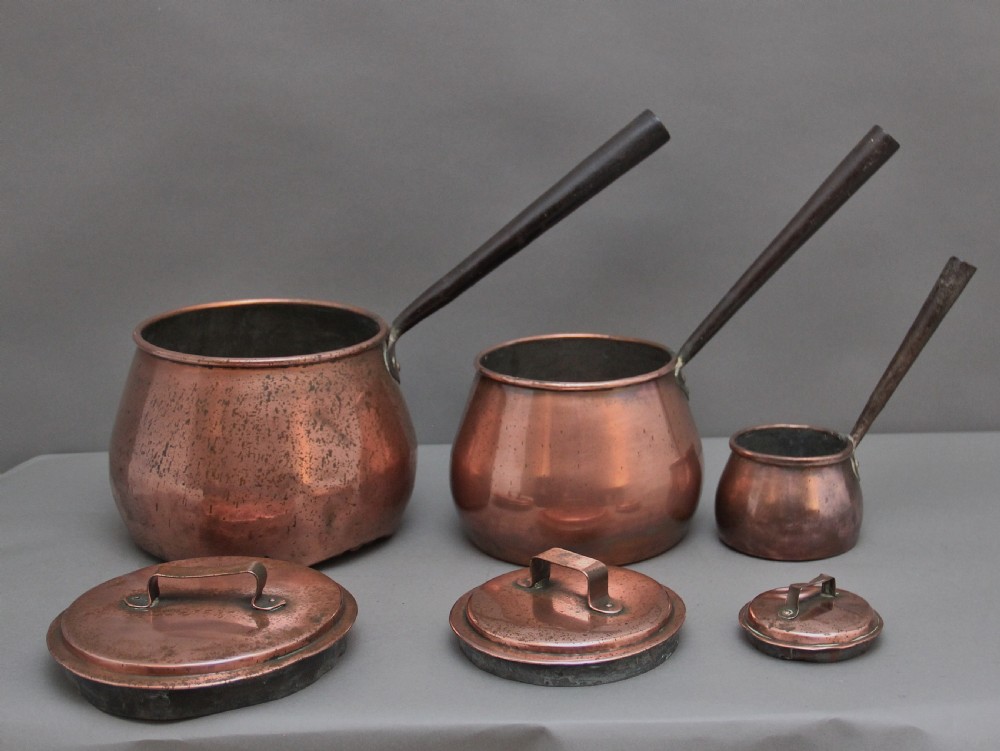 A set of three Victorian copper saucepans View VI