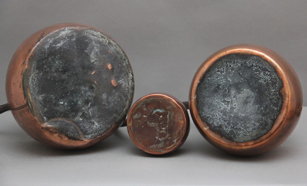 A set of three Victorian copper saucepans View VIII