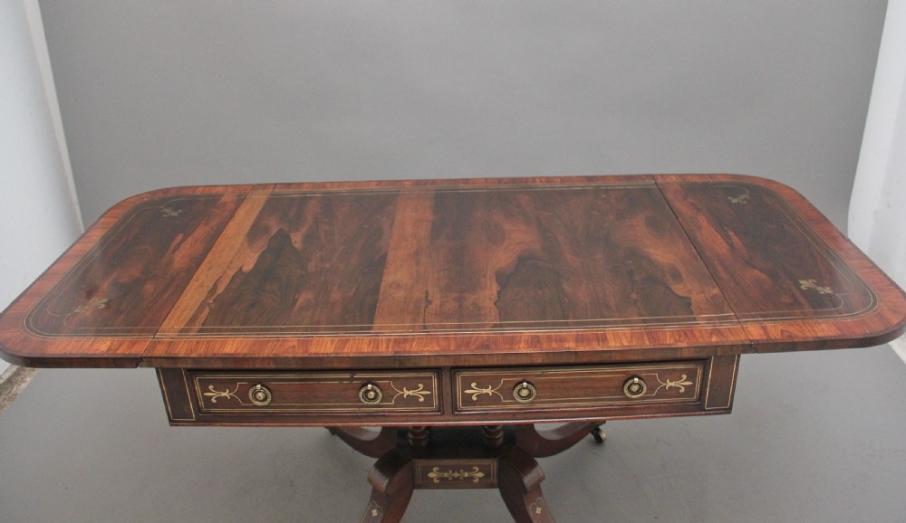 Regency rosewood and brass inlaid sofa table View VII