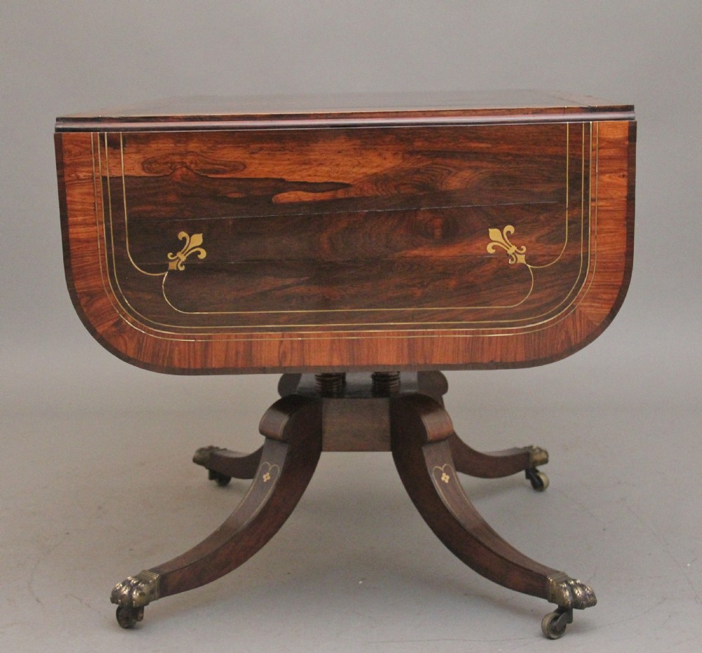 Regency rosewood and brass inlaid sofa table View IX
