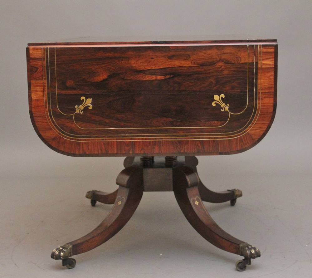 Regency rosewood and brass inlaid sofa table View XII