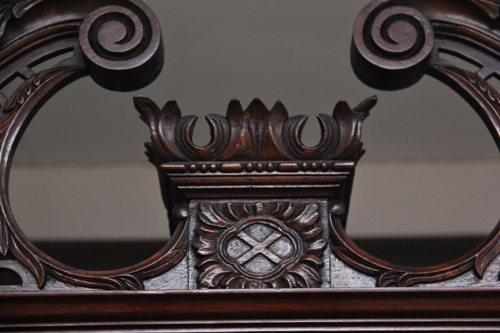 An early nineteenth-century mahogany bureau bookcase featuring a swan-neck pediment, diamond astragal glazed upper doors, a slant-front writing flap, and four graduated drawers. View XIII