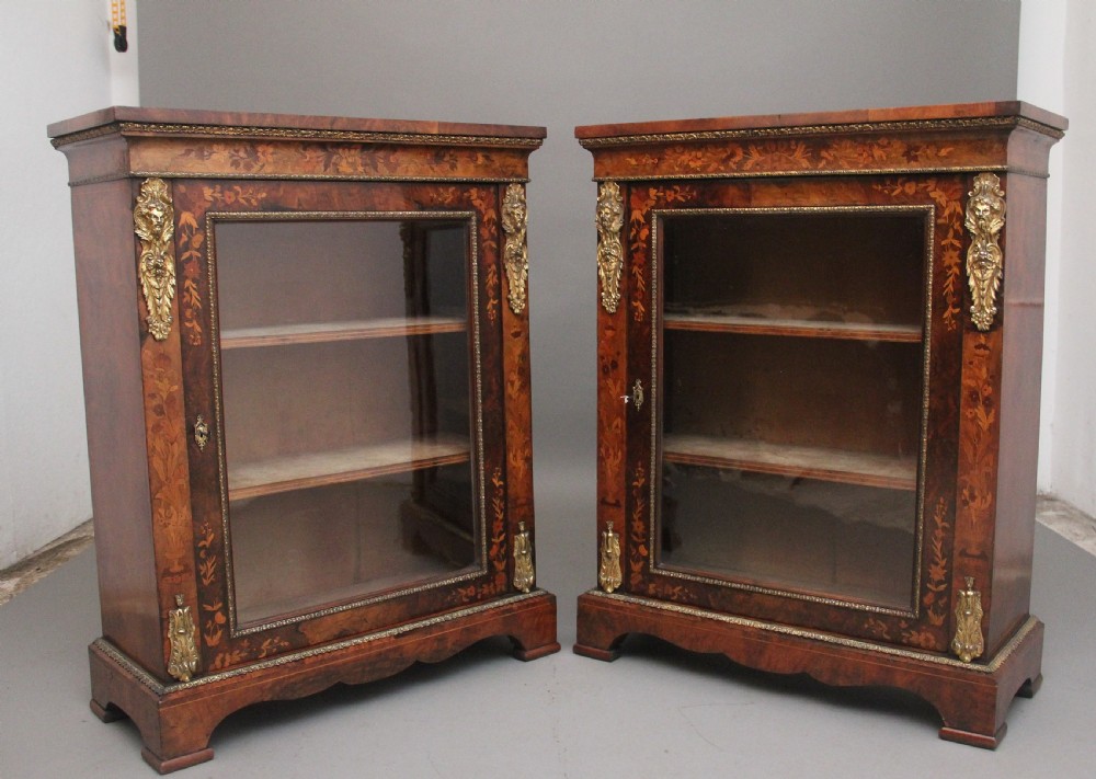 Pair of 19th Century walnut pier cabinets by Edwards & Roberts