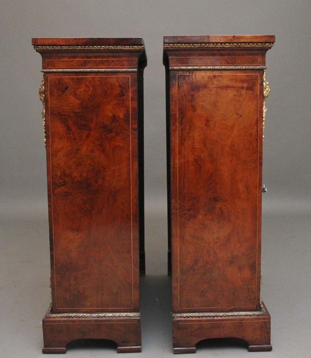 Pair of 19th Century walnut pier cabinets by Edwards & Roberts View VII