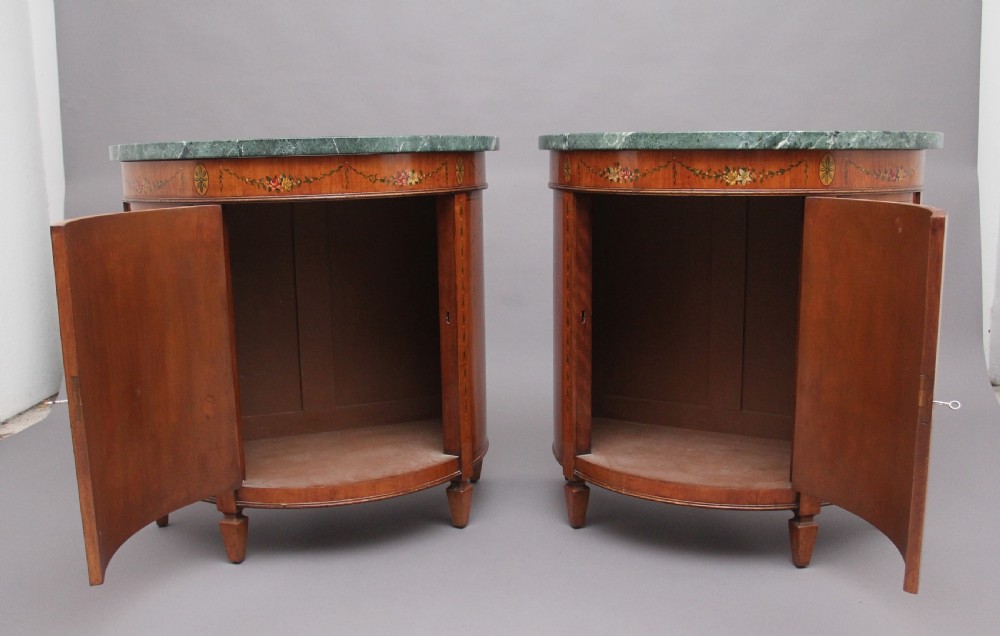 Pair of early 20th Century satinwood and painted demi lune cabinets View II