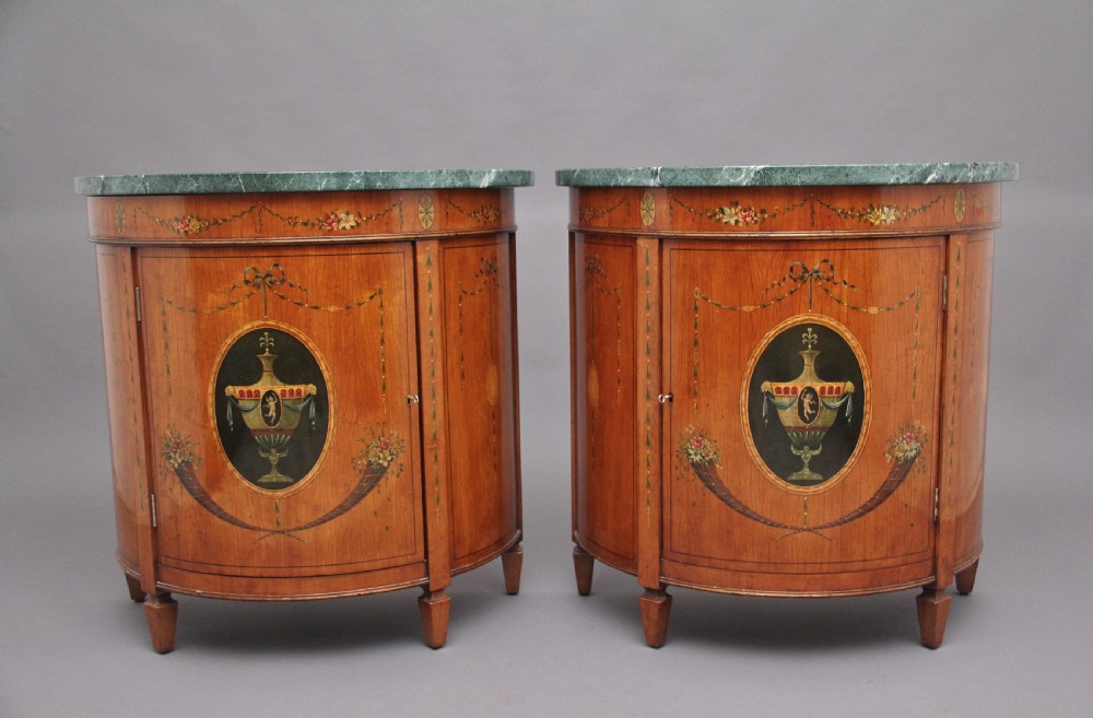 Pair of early 20th Century satinwood and painted demi lune cabinets View III
