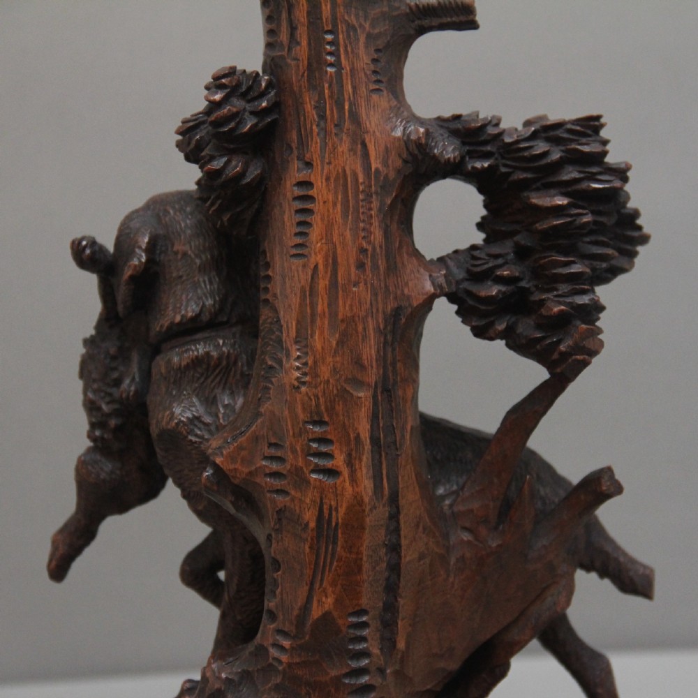 A nineteenth-century carved dark wood Black Forest centrepiece featuring a hunting dog holding game beneath a clear cut-glass trumpet vase. View XI