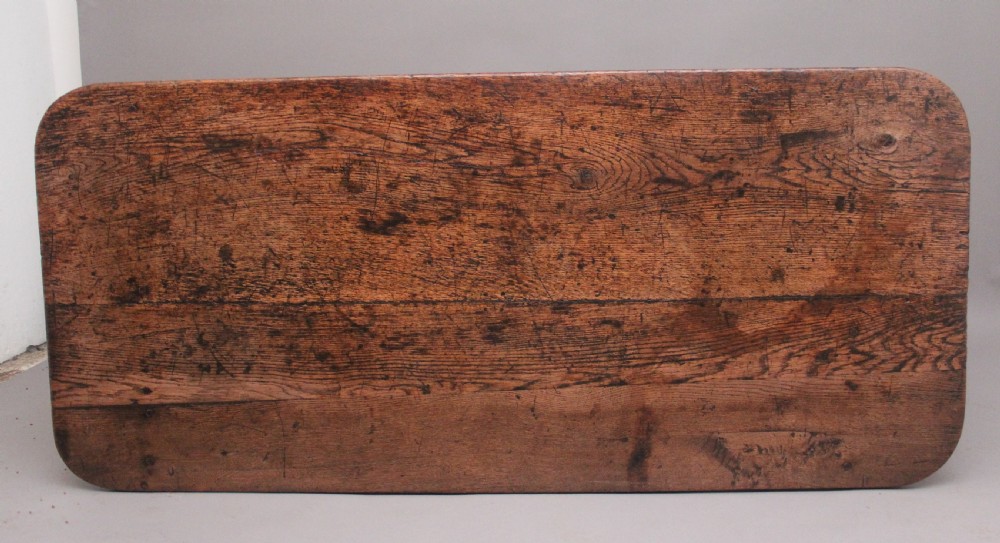A 17th-century oak refectory table featuring a plank top, turned legs, and a perimeter box stretcher base. View V