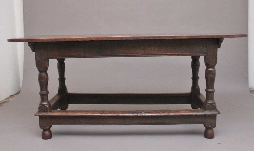 A 17th-century oak refectory table featuring a plank top, turned legs, and a perimeter box stretcher base. View VIII