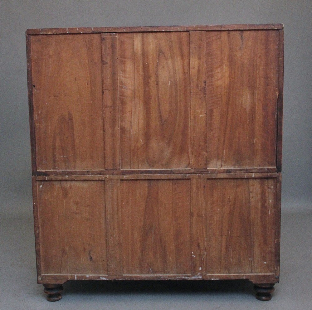 A 19th-century camphor wood military campaign chest featuring brass corner mounts, flush handles, ebonised drawer surrounds, and turned feet. View XIII