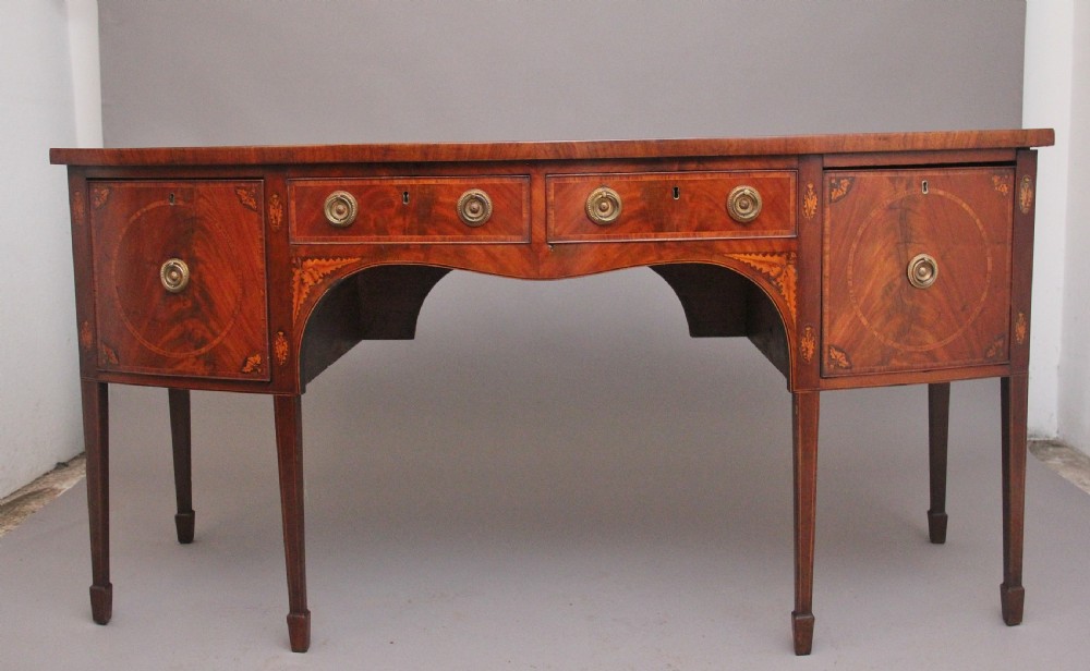 A superb quality Georgian inlaid mahogany bowfront sideboard