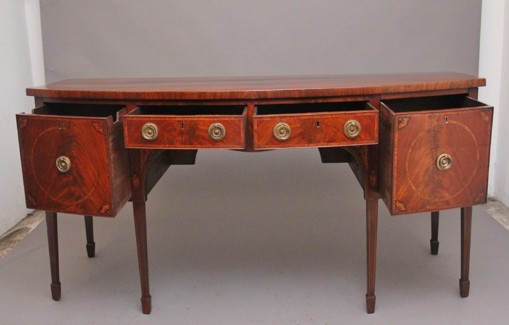 A superb quality Georgian inlaid mahogany bowfront sideboard View II