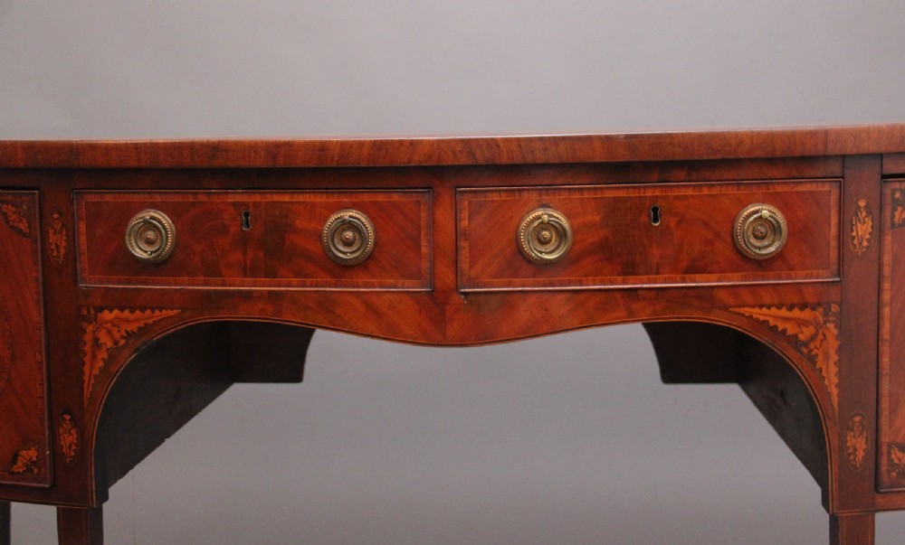 A superb quality Georgian inlaid mahogany bowfront sideboard View V