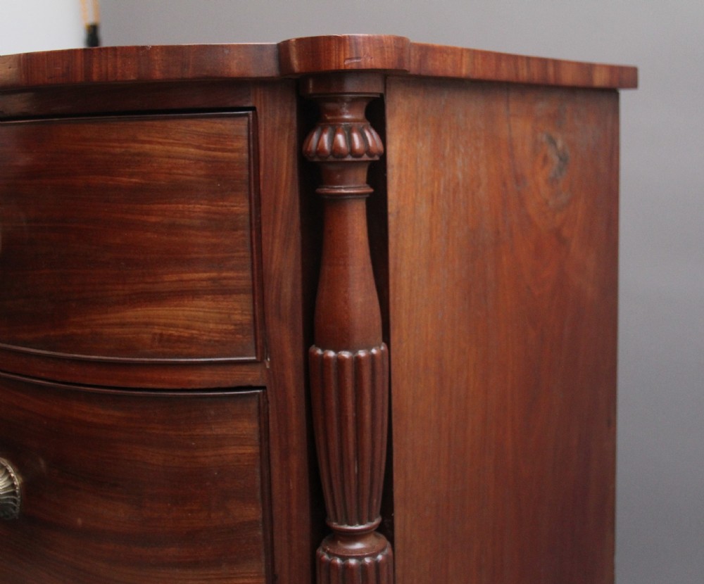 A 19th-century mahogany bowfront chest of drawers featuring two short over three long drawers flanked by reeded side columns. View III