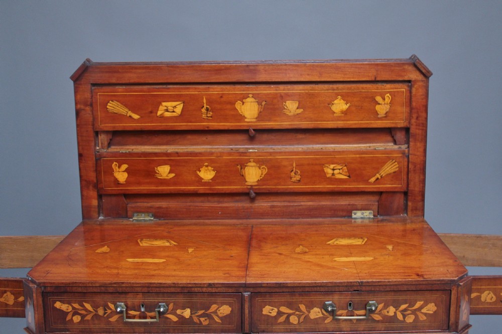 An early 19th-century Dutch travelling cabinet featuring floral fruitwood marquetry inlays, two upper drawers, two panelled doors, and side drop handles. View XIV