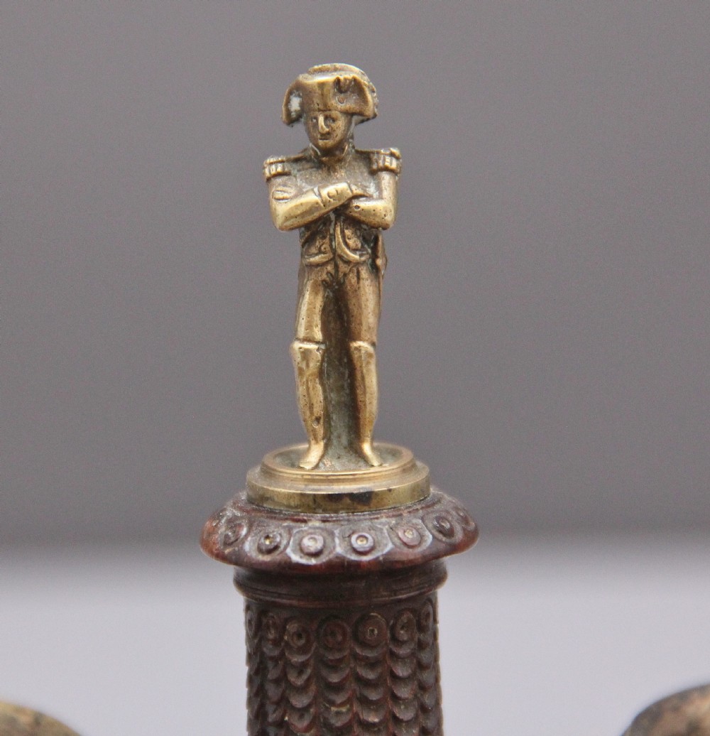 A 19th-century mahogany desk set featuring two metal inkwells, a central column topped with a small gilt figure, and four detailed claw feet. View VIII