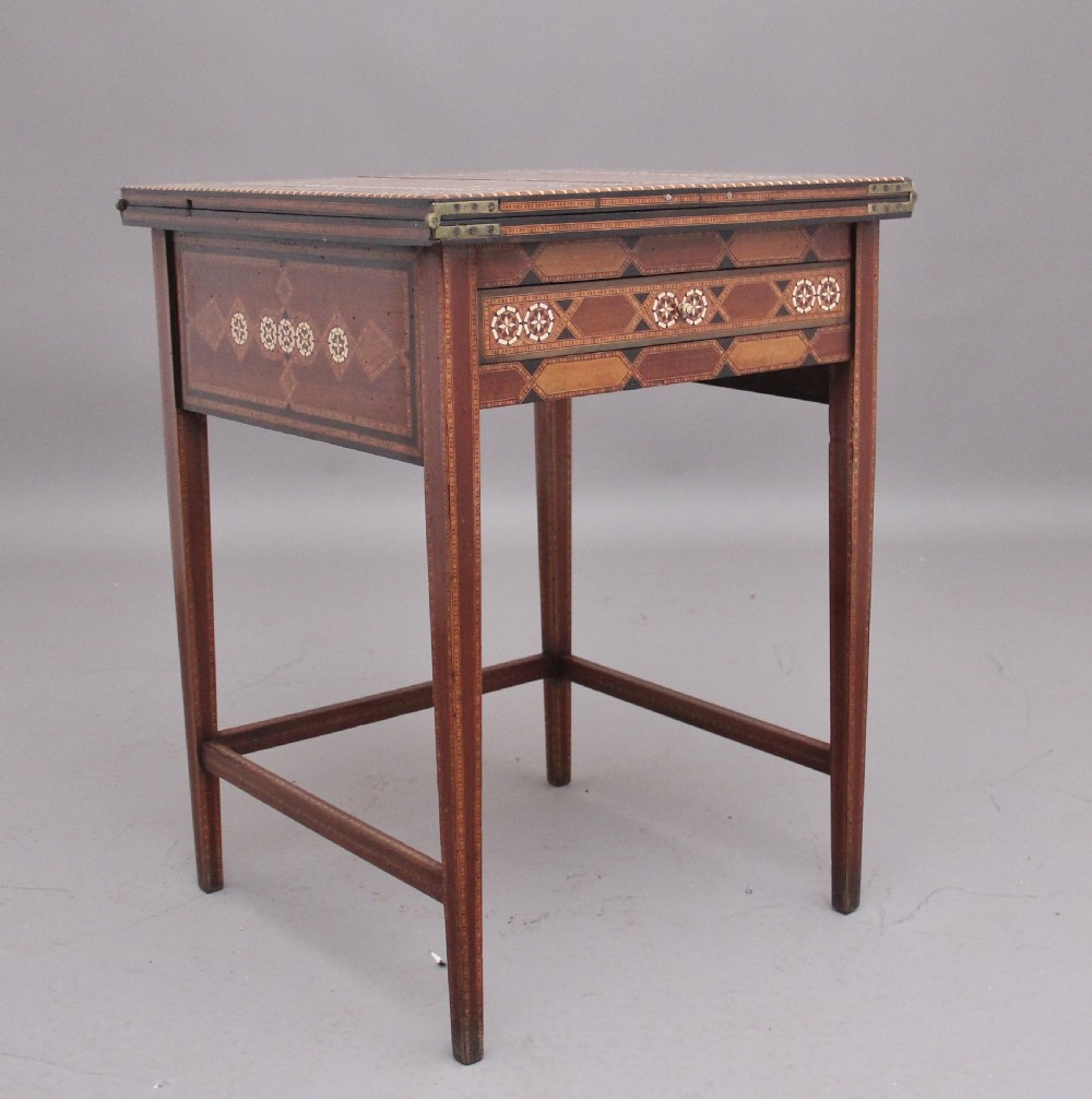 A 19th-century Syrian metamorphic writing table with geometric mother-of-pearl inlay, side flap leaves, and a green writing surface. View II