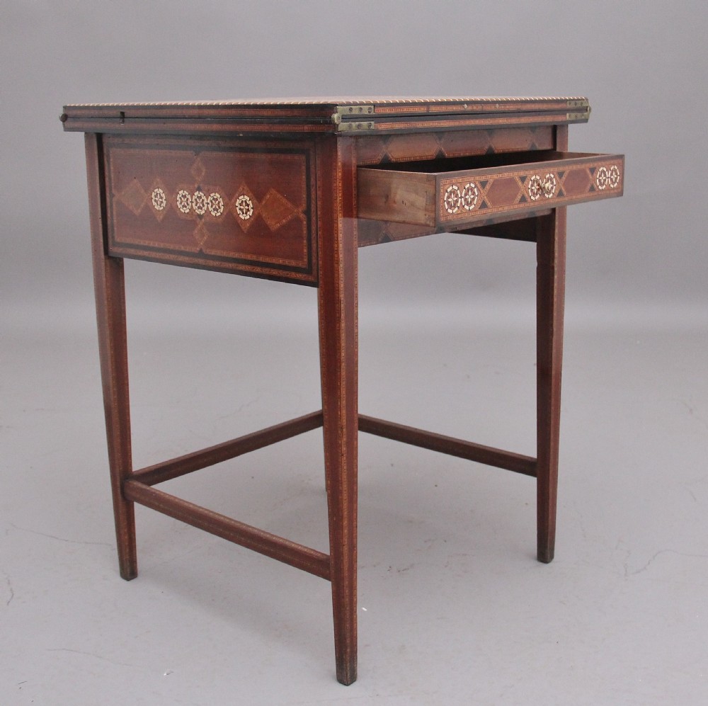 A 19th-century Syrian metamorphic writing table with geometric mother-of-pearl inlay, side flap leaves, and a green writing surface. View III