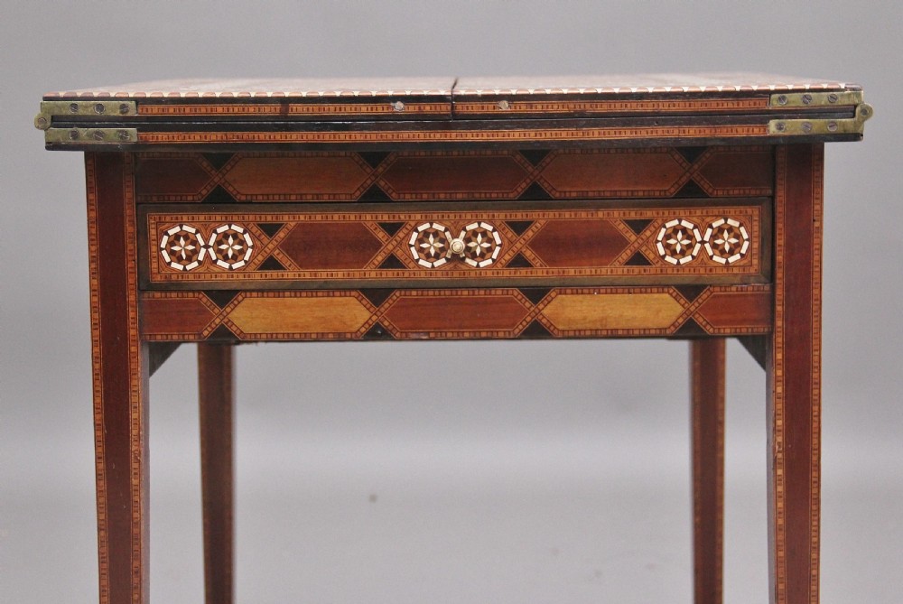 A 19th-century Syrian metamorphic writing table with geometric mother-of-pearl inlay, side flap leaves, and a green writing surface. View VII
