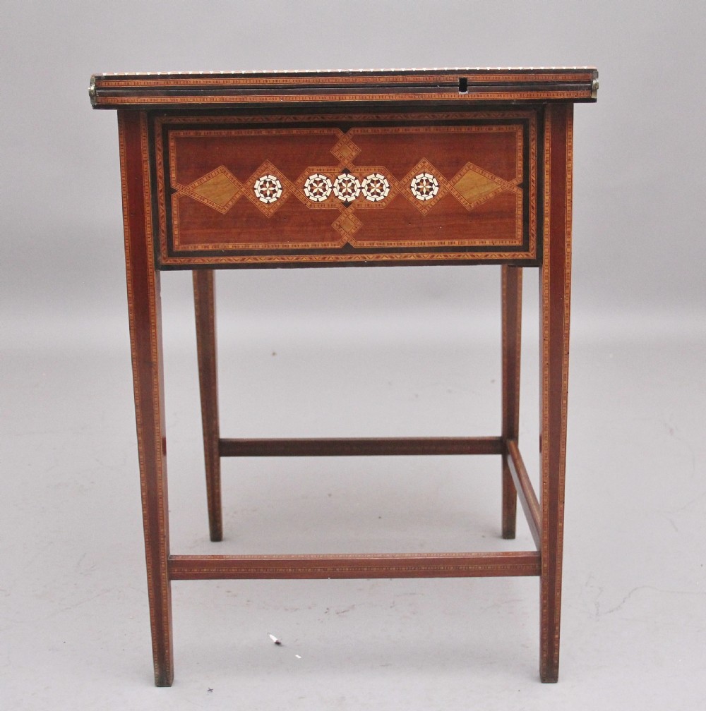 A 19th-century Syrian metamorphic writing table with geometric mother-of-pearl inlay, side flap leaves, and a green writing surface. View VIII