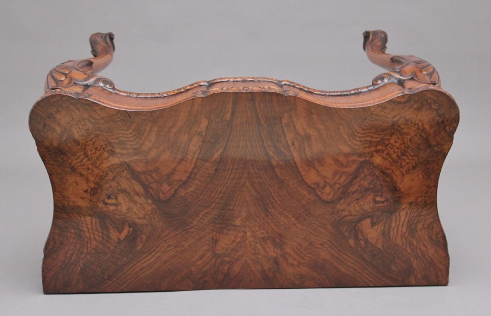 An early twentieth-century carved walnut card table featuring cabriole legs with shell motifs and a contoured apron. View X