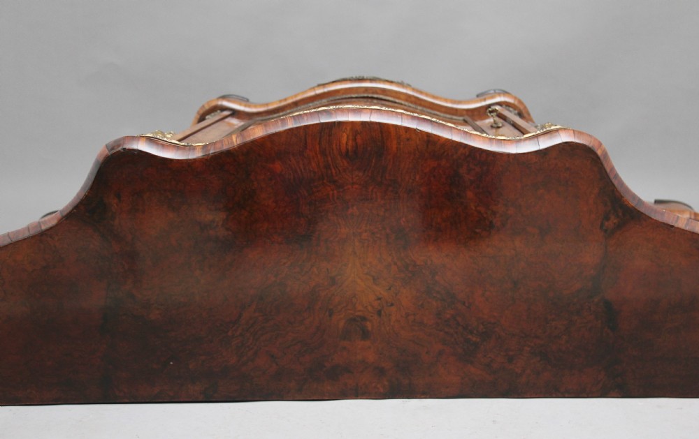 A 19th-century burr walnut credenza featuring a central door with floral marquetry inlay, flanked by two curved glazed doors and detailed ormolu mounts. View III