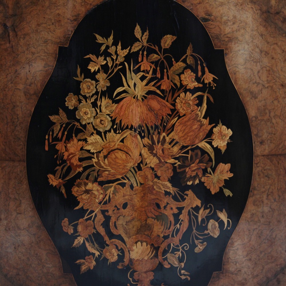 A 19th-century burr walnut credenza featuring a central door with floral marquetry inlay, flanked by two curved glazed doors and detailed ormolu mounts. View XX